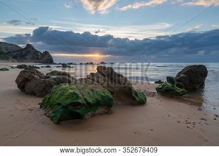 Praia Do Amado Beach At Sunset In Costa Vicentina, Portugal