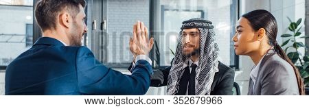 Panoramic Shot Of Professional Multicultural Business Partners Giving Highfive On Meeting With Trans