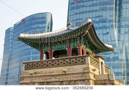 Seoul, Republic of Korea - March 2019: Dongshipjagak, ancient watchtower, Seoul landmark. Modern office buildings in the background.