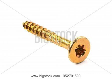 Gold Torx Screw Isolated On White. Yellow Zinc Chipboard Screw Torx, , Full Thread Close Up