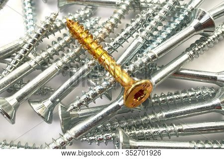 Torx Screws Close Up. Gold Screws For Wood, Chipboard Or Plywood With Torx Head.