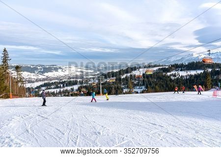 Bialka Tatrzanska, Poland - February 22, 2020: People Skiing On The Slope Of Kotelnica Bialczanska S