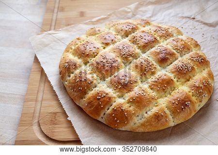 Freshly Baked Flat Bread In The Style Of Turkish Ramadan Pide On A Kitchen Board, Selected Focus, Na