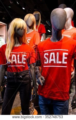 Decoration Of The Entrance To The Store In The Mall. Signboard Sale With White Letters On A Red Back