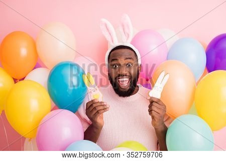 Photo Of Funny Dark Skin Guy Colorful Decorations Easter Party Hold Two Pretty Ginger Bread Cookies 