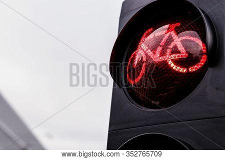 Traffic Light For Cyclists. Red Light For Bycicle Lane On A Traffic Light. Traffic Light In Red For 