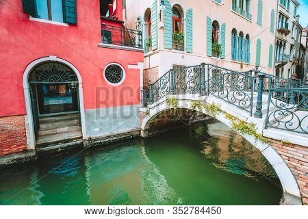 Venice, Italy. Ponte Giustinian Bridge Over A Canal Located In Campo San Vidal