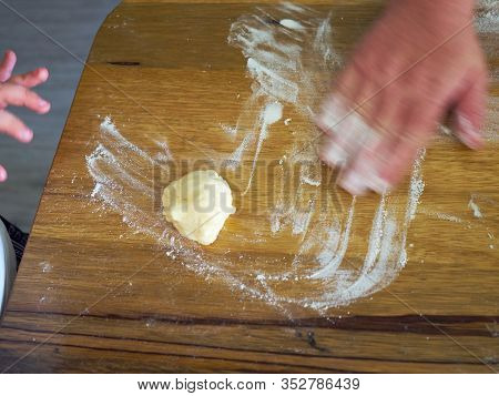 Mother And A Daugter Baking Together In The Kitchen Preparing The Dough To  Bake A Cake