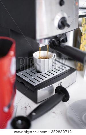 Budapest, Hungary - April 1, 2019: Coffee Making Process With Household Electrolux Coffee Machine.