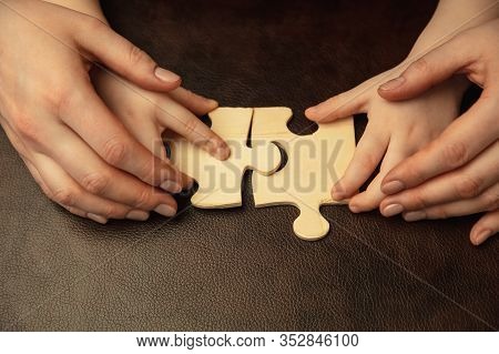 Collecting Pazzles, Building Future. Close Up Shot Of Female And Kids Hands Doing Different Things T