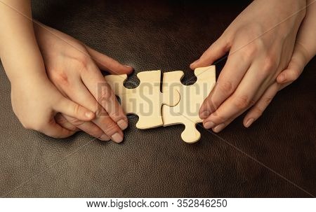 Collecting Pazzles, Building Future. Close Up Shot Of Female And Kids Hands Doing Different Things T