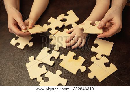 Collecting Pazzles, Building Future. Close Up Shot Of Female And Kids Hands Doing Different Things T