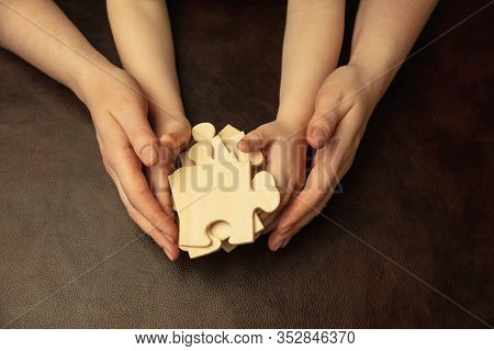 Collecting Pazzles, Building Future. Close Up Shot Of Female And Kids Hands Doing Different Things T