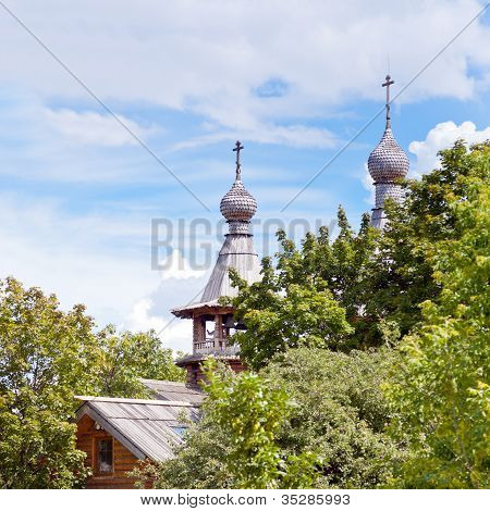 Wooden Church In Green Garden