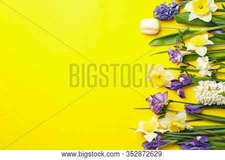 Flat Lay Composition With Spring Flowers On Yellow Background. Space For Text