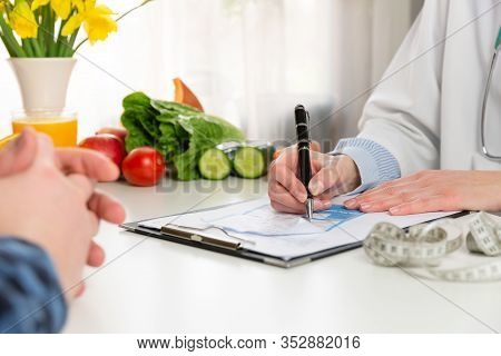 Vegetable Diet Nutrition And Medication Concept. Nutritionist Offers Healthy Vegetables Diet. In A N