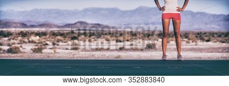 Runner athlete woman standing by trail road landscape banner panoramic. Crop of lower body legs wearing running shoes ,compression shorts.