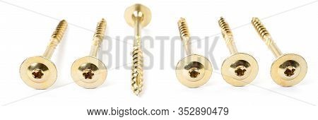 Torx Screws On White Background Close Up. Gold Yellow Screws For Wood, Chipboard Or Plywood With Big