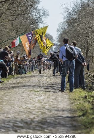 Wallers,france - April 12,2015: The Breakaway Approaching Through A Crowd Of Excited Spectators In T
