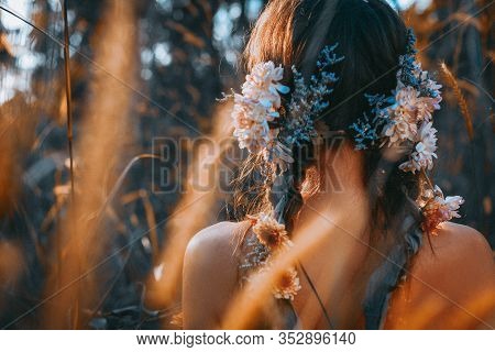 Close Up Portrait Of Young And Tender Woman On A Feild At Sunset