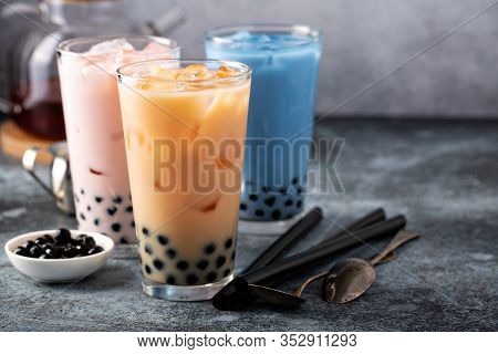 Variety Of Milk Bubble Tea In Tall Glasses, Strawberry, Butterfly Tea And Black