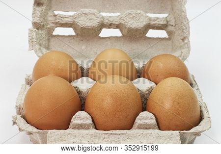 Fresh Eggs In An Egg Box Isolated On White