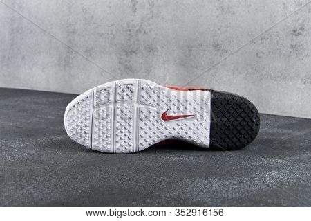 Sole Unit Of Red Nike Air Max Typha Sneakers, Running Shoes, Trainers Close Up View, Shot On Grey Ab