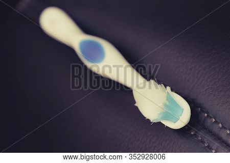Used Toothbrush With Toothpaste On A Dark Background - Teeth Hugiene
