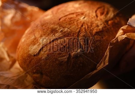 Different Buns Of Fresh Bread On A Brown Vintage Background. Freshly Baked Wheat Bread, Still Life W