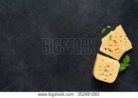 Radamer Cheese On A Black Concrete Background. View From Above.