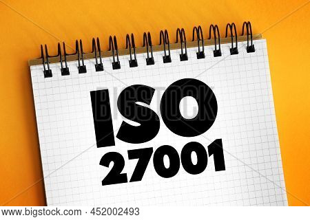Iso 27001 - International Standard On How To Manage Information Security, Text Concept On Notepad