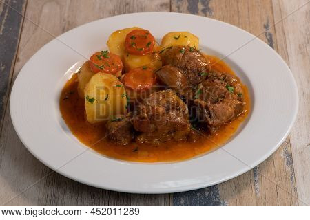 Navarin Lamb Shank Stew On Wood Table And And Potatoes, High Quality Photo