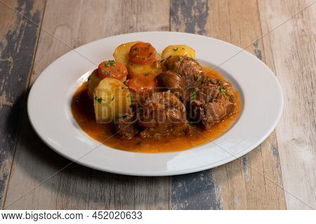 Navarin Lamb Shank Stew On Wood Table And And Potatoes, High Quality Photo