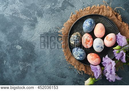 Easter Eggs. Dyed Easter Eggs With Marble Stone Effect Ref And Blue Color In Rustic Style On Dark St