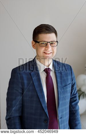 Portrait Of A Male Freelancer. Decentralized Work Of Digital Nomads, Hybrid Work Model.