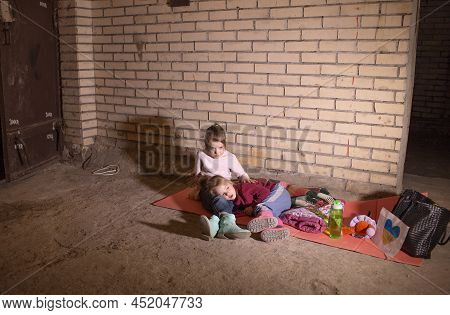 Kiev, Ukraine - March 24, 2022: The War In Ukraine. The Life Of Children In A Bomb Shelter At A Metr