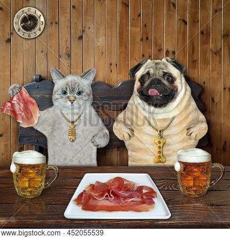 An Ashen Cat And A Dog Pug Are Eating Raw Meat With Beer In A Restaurant.