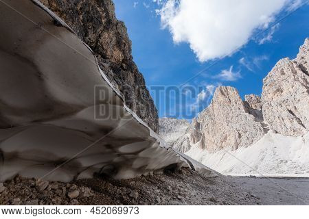 Melting Snow At Antermoia Lake, Dolomites, Catinaccio Group. Italian Dolomites Landscape