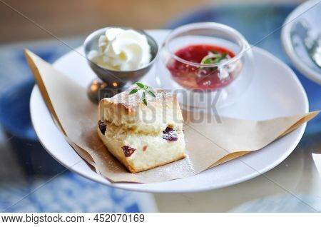 Scone , Cranberry Scone Or Scone With Whipped Cream And Strawberry Dip