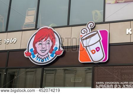 Kutaisi, Georgia - March 19, 2022: Logos Of Wendy's And Dunkin' Donuts.