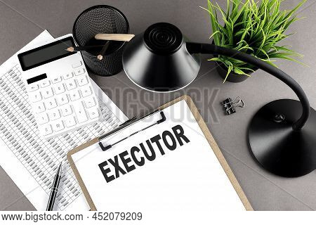 Clipboard ,chart And Calculator, Lamp And Workspace Accessories On Grey Table. Top View , Text Execu