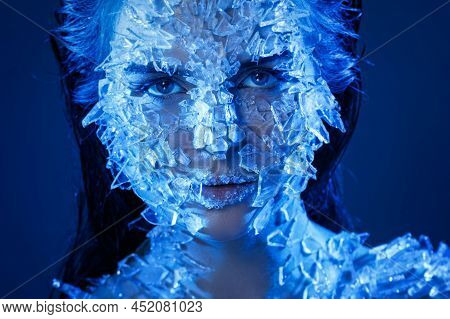 Female Face Covered With A Lot Small Pieces Of Glass Or Ice