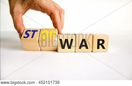 Stop War Symbol. Businessman Turns Cubes And Changes Concept Words War To Stop War. Beautiful White 