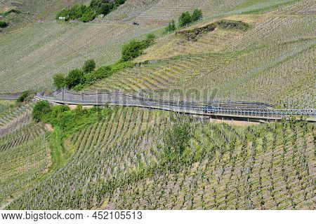 Mosel Vineyards With A Steep Road Going Through