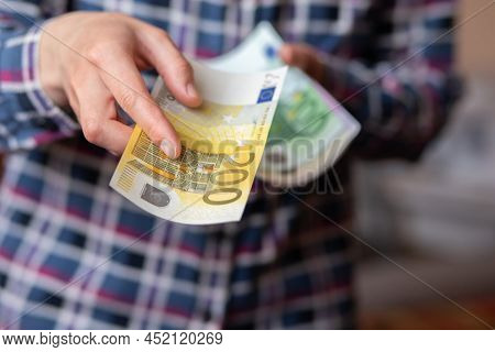 Woman Counts Money. Female Hands Hold Cash Banknotes Denominations Of 200 Euro Currency. Business Ma