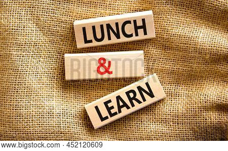 Lunch And Learn Symbol. Concept Words Lunch And Learn On Wooden Blocks. Beautiful Canvas Table Canva