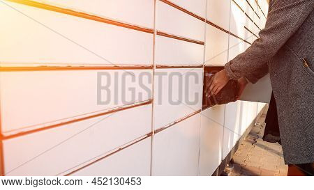 Postal Terminal. Post Delivery Automat Service And Hands With Parcel Courier Box. Mail Delivery And 
