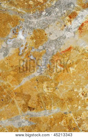Nahaufnahme einer gelben und grauen veined Marmor Oberfläche