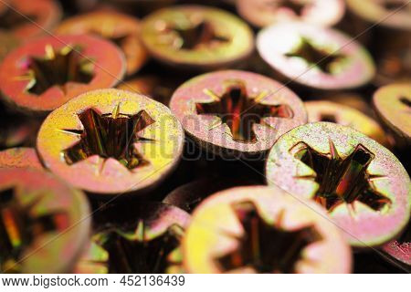 Anodized Screw Caps Close-up. A Vivid Illustration On The Theme Of Hardware And Fasteners. Materials
