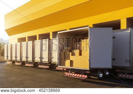 Row Of Truck, Back View, Cardboard Boxes Package, Garage Outdoors. Concept Of Delivery And Wholesale